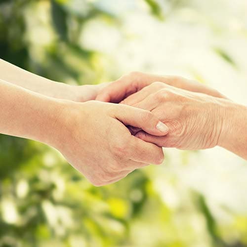 A carer offering support to someone with chronic illness